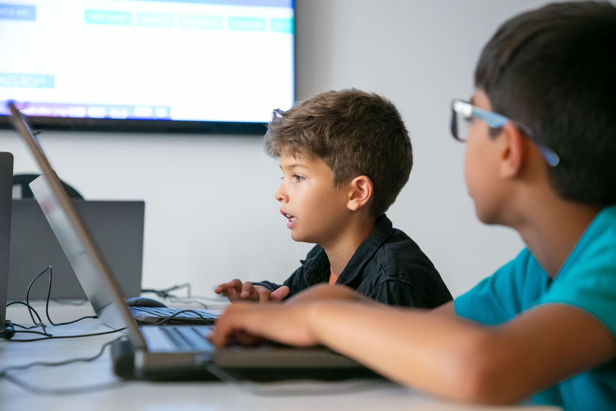Young people working through a coding session at Harris Chobham Academy
